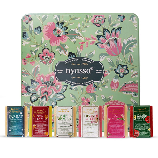 Nyassa soap bars with floral packaging on a white background
