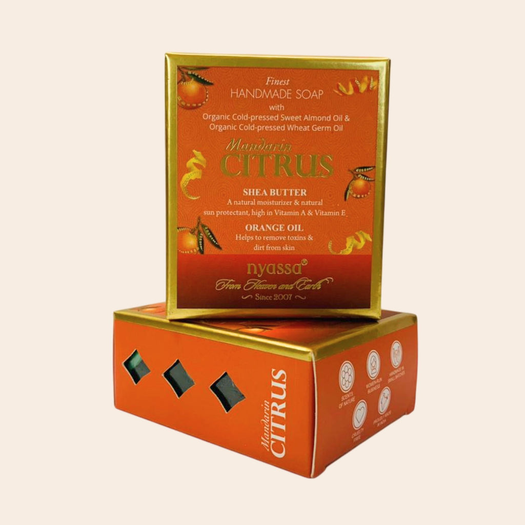 Nyassa Mandarin Citrus soap packaging on a beige background