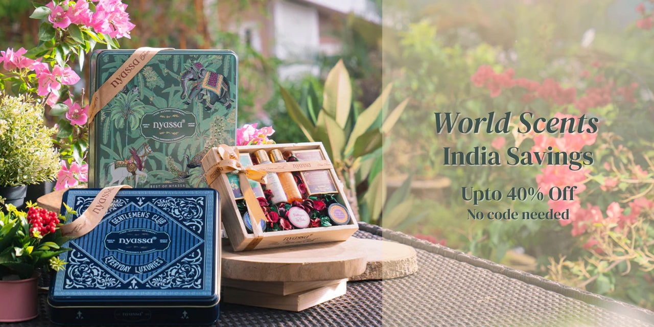 Fragrance set with flowers and promotional text for World Scents India Savings offer.