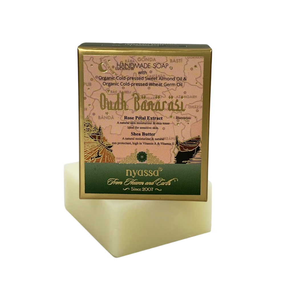 Bar of soap with a gold and green packaging on a white background