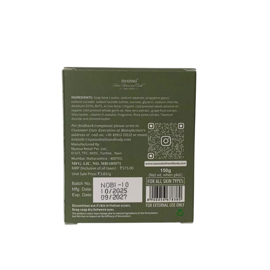 Back view of a green soap packaging with text and bar code on a white background
