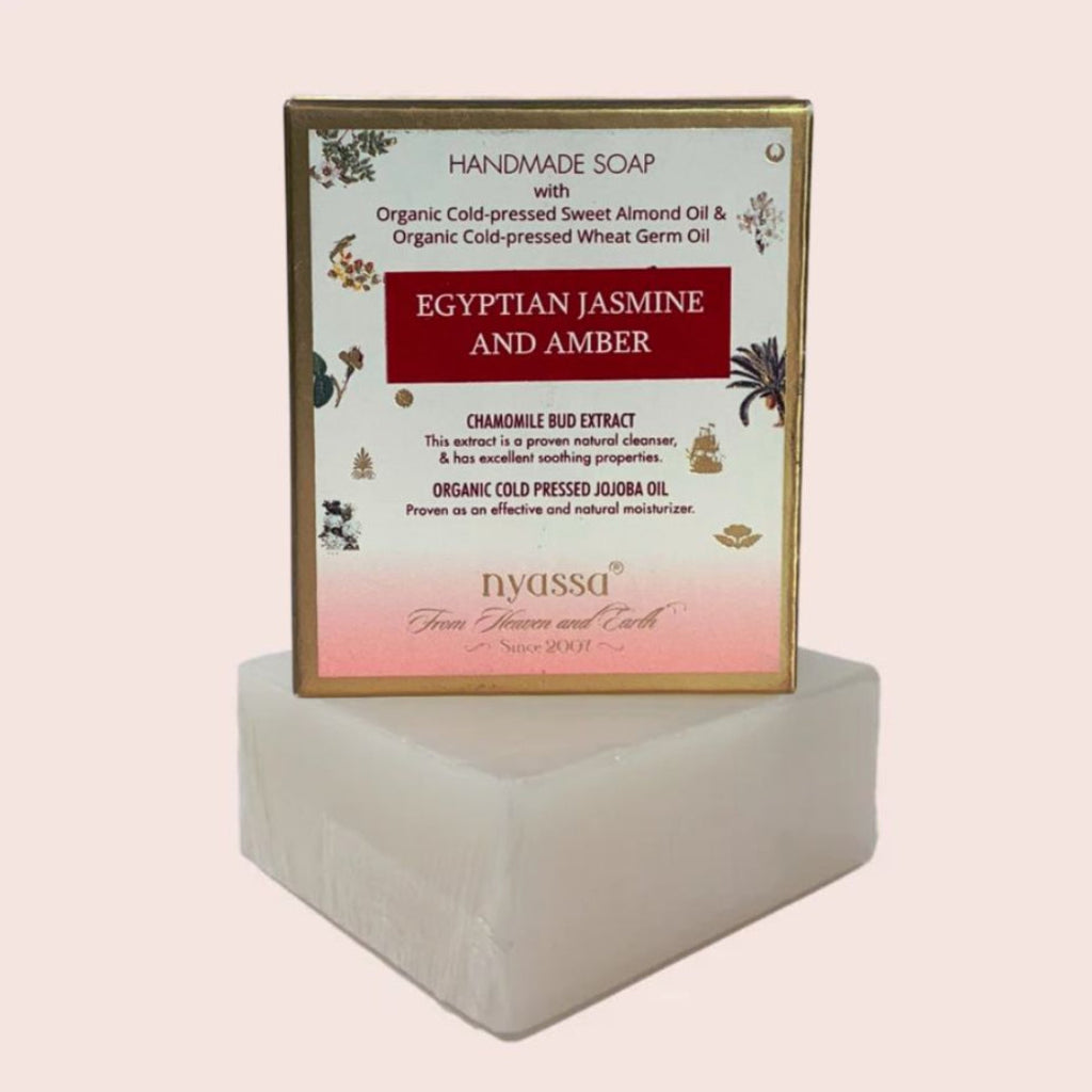 Handmade soap with 'Egyptian Jasmine and Amber' label on a white background