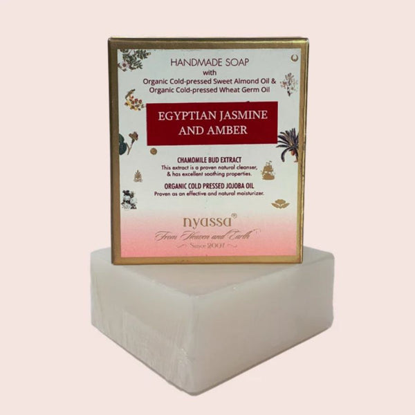 Handmade soap with 'Egyptian Jasmine and Amber' label on a white background