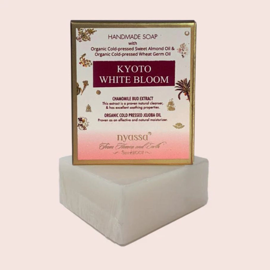 Handmade soap with 'Kyoto White Bloom' label on a white background