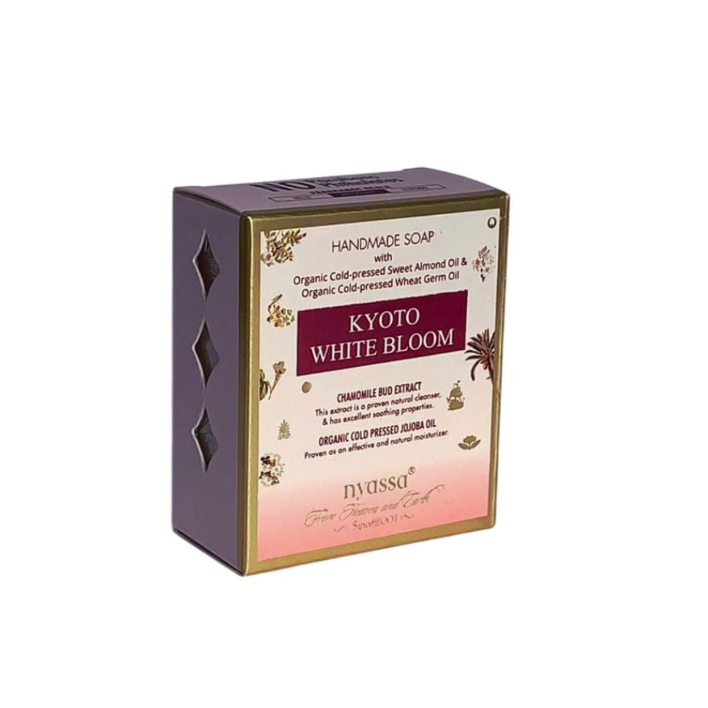 Handmade soap packaging with 'Kyoto White Bloom' branding on a white background