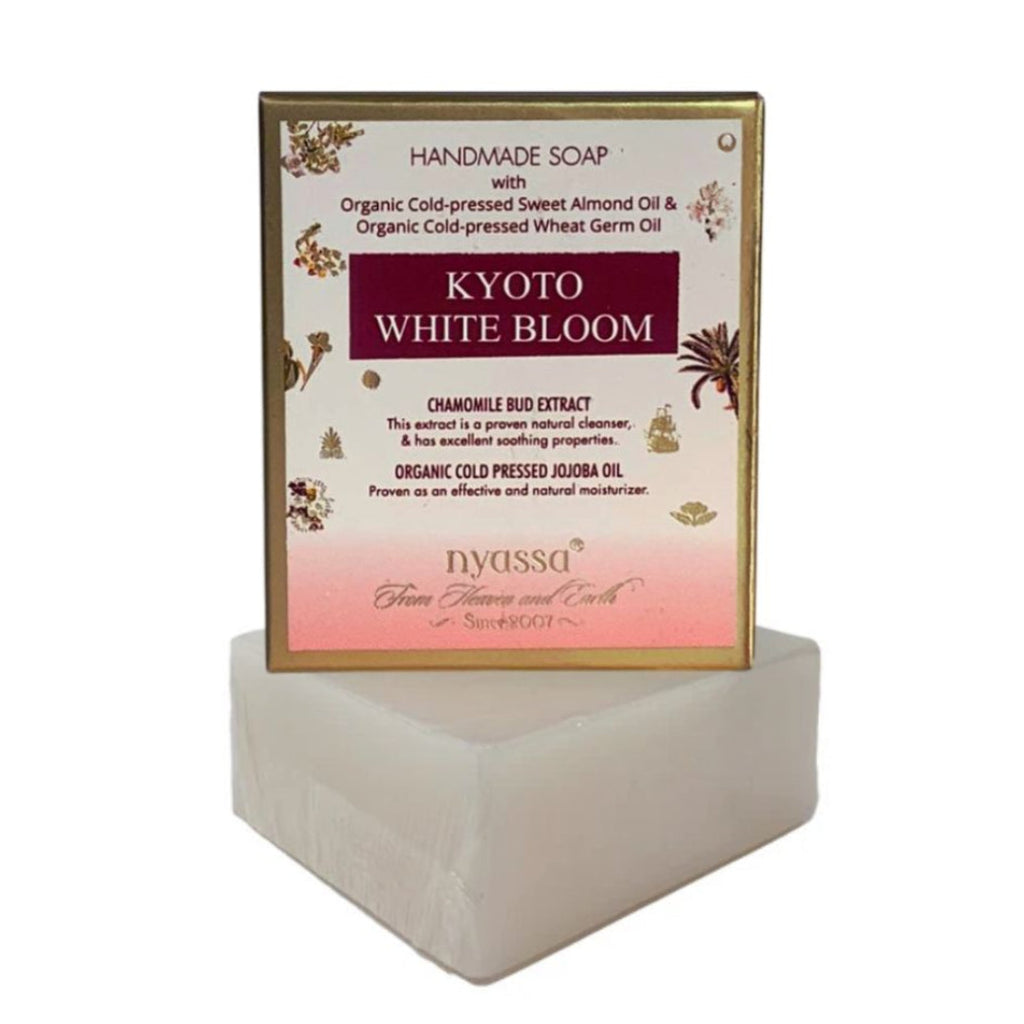 Handmade soap with 'Kyoto White Bloom' packaging on a white background
