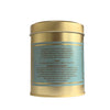 Gold metal tea canister with a label on a white background