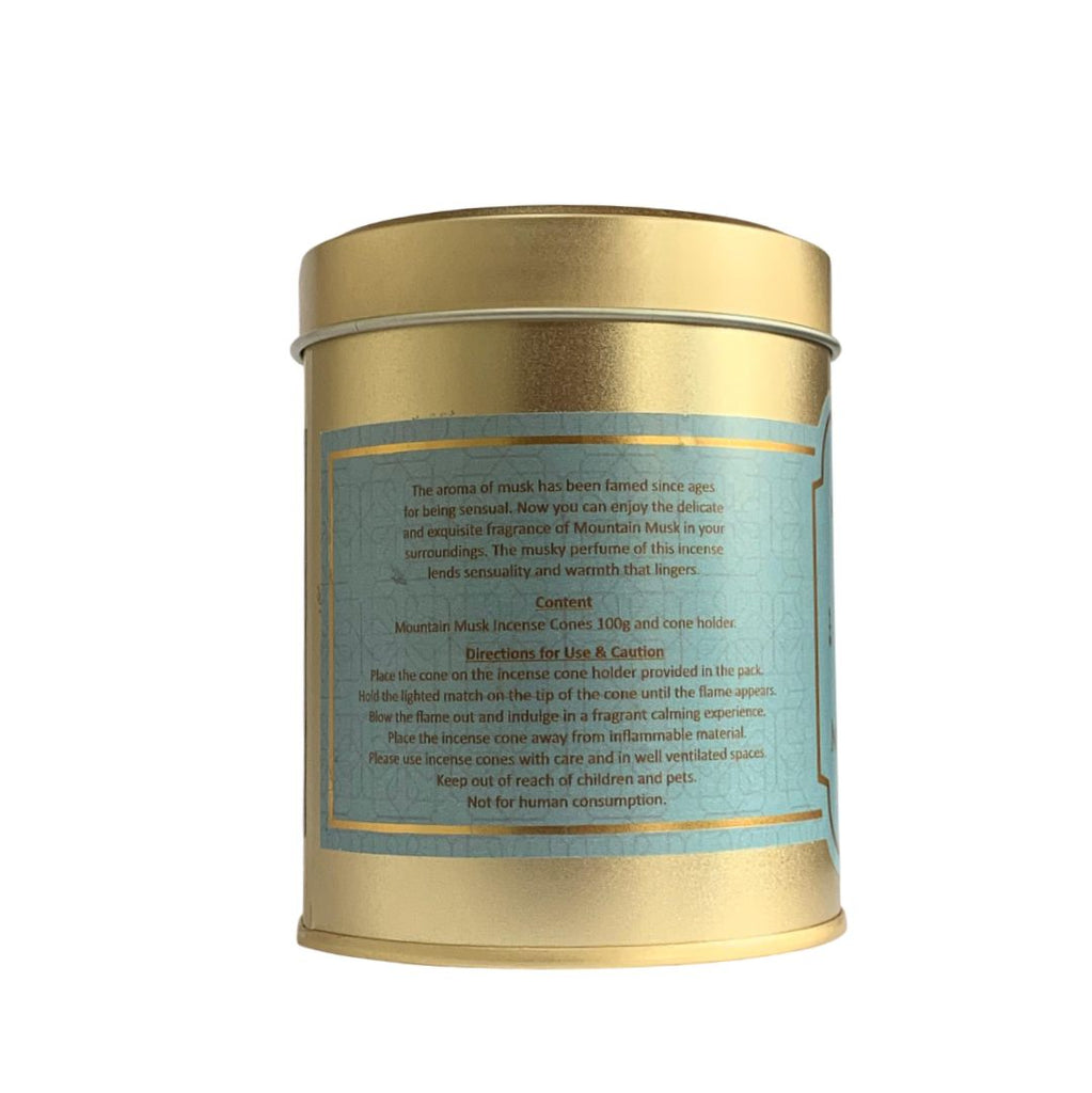 Gold metal tea canister with a label on a white background