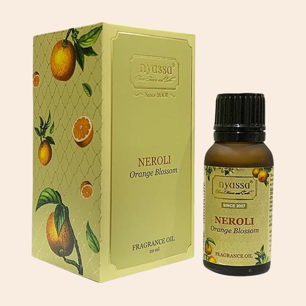 Nyassa Neroli Orange Blossom fragrance oil bottle and packaging on a beige background