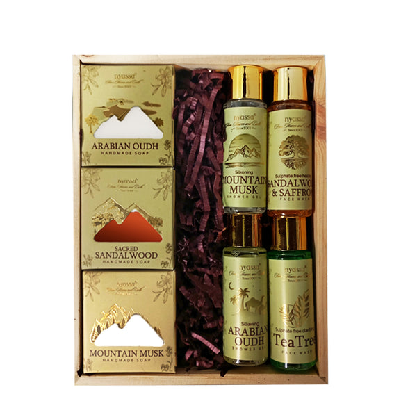 Gift set with soap bars and essential oils in a wooden box